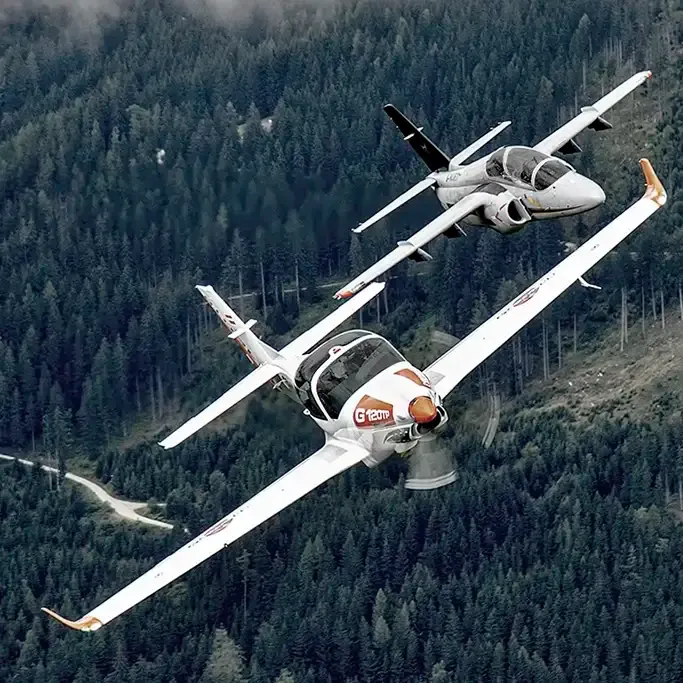 Two planes flying next to each other